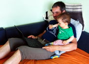 Grandfather+grandson watching debconf.jpg